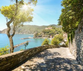 View from hiking trail to beautiful coastline and beach of mediterranean sea near village Monterosso al Mare in early summer, Cinque Terre Liguria Italy Europe